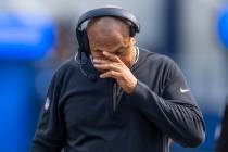 Raiders head coach Antonio Pierce walks dejected on the sidelines after a late failed drive dur ...