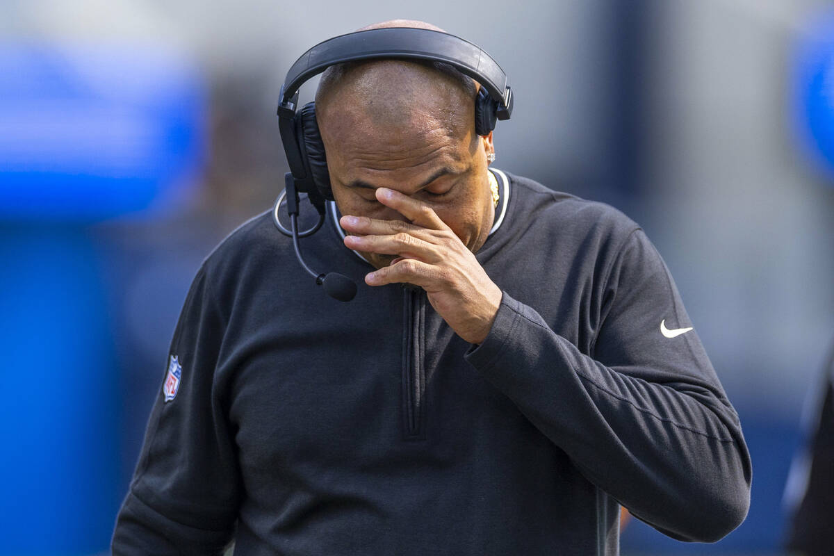 Raiders head coach Antonio Pierce walks dejected on the sidelines after a late failed drive dur ...