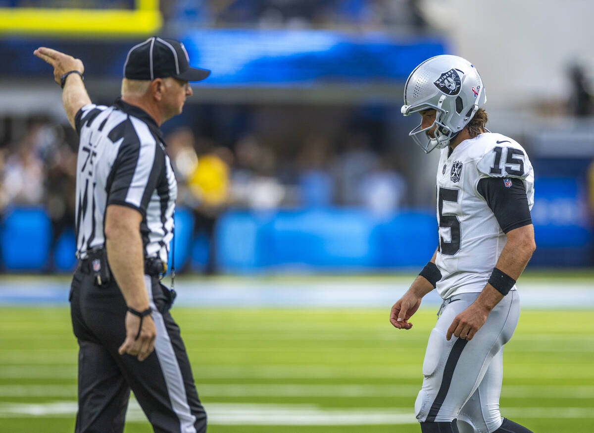 Raiders quarterback Gardner Minshew (15) walks off the field after a failed late drive against ...