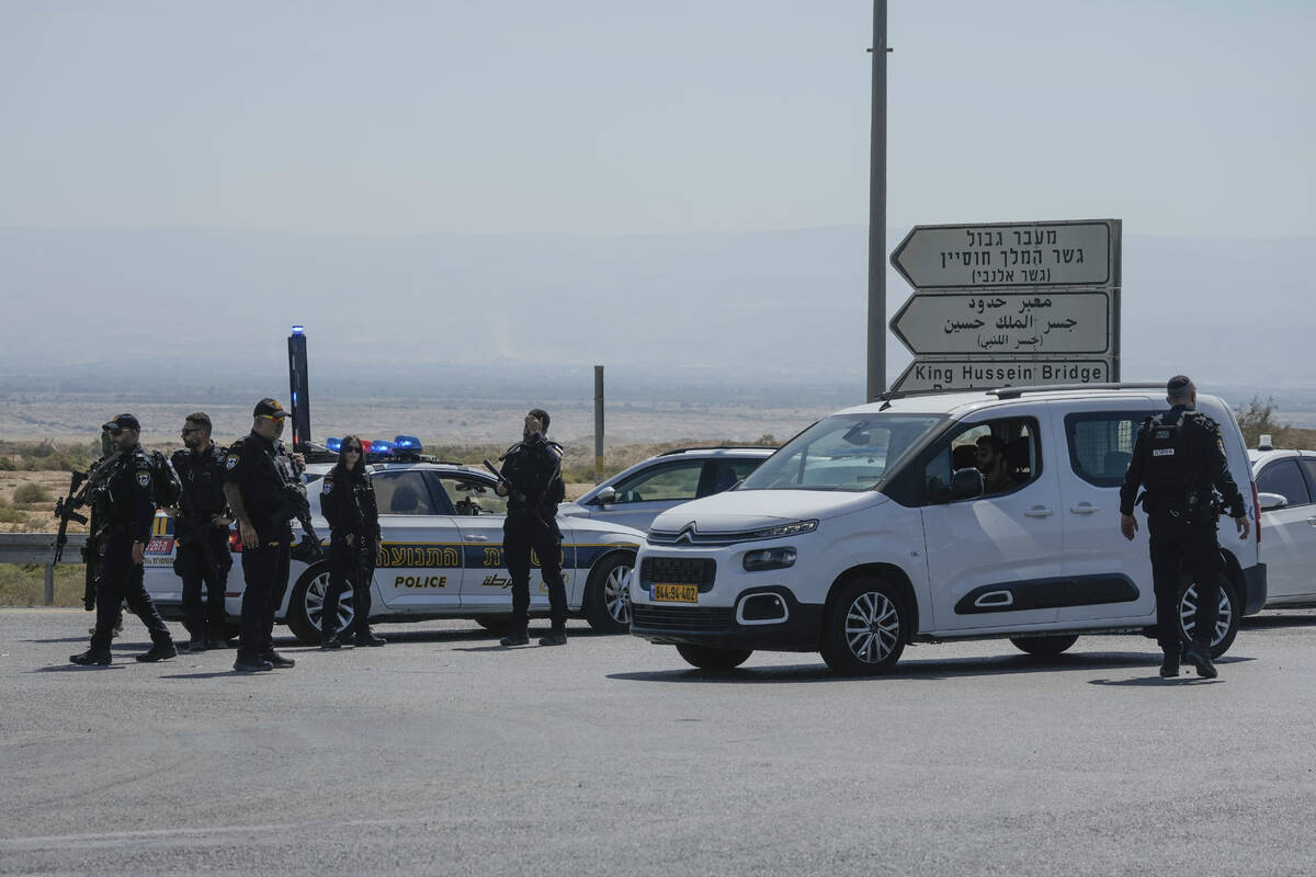 Israeli police stand guard near the site of a deadly shooting attack where Israeli officials sa ...