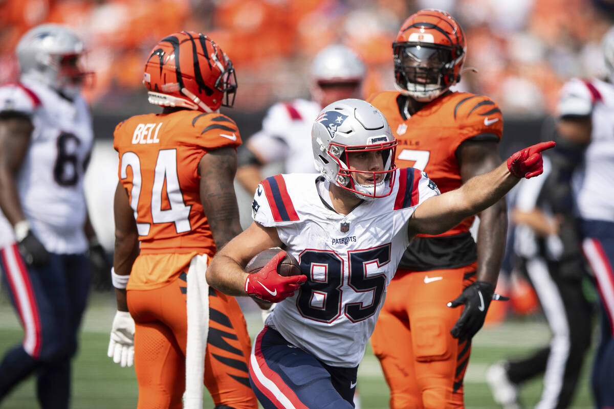 New England Patriots tight end Hunter Henry (85) celebrates after carrying the ball in the seco ...