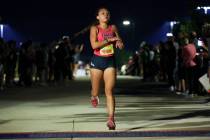 Shadow Ridge’s Elynn Okuda crosses the finish line during the Red Rock Running Company I ...