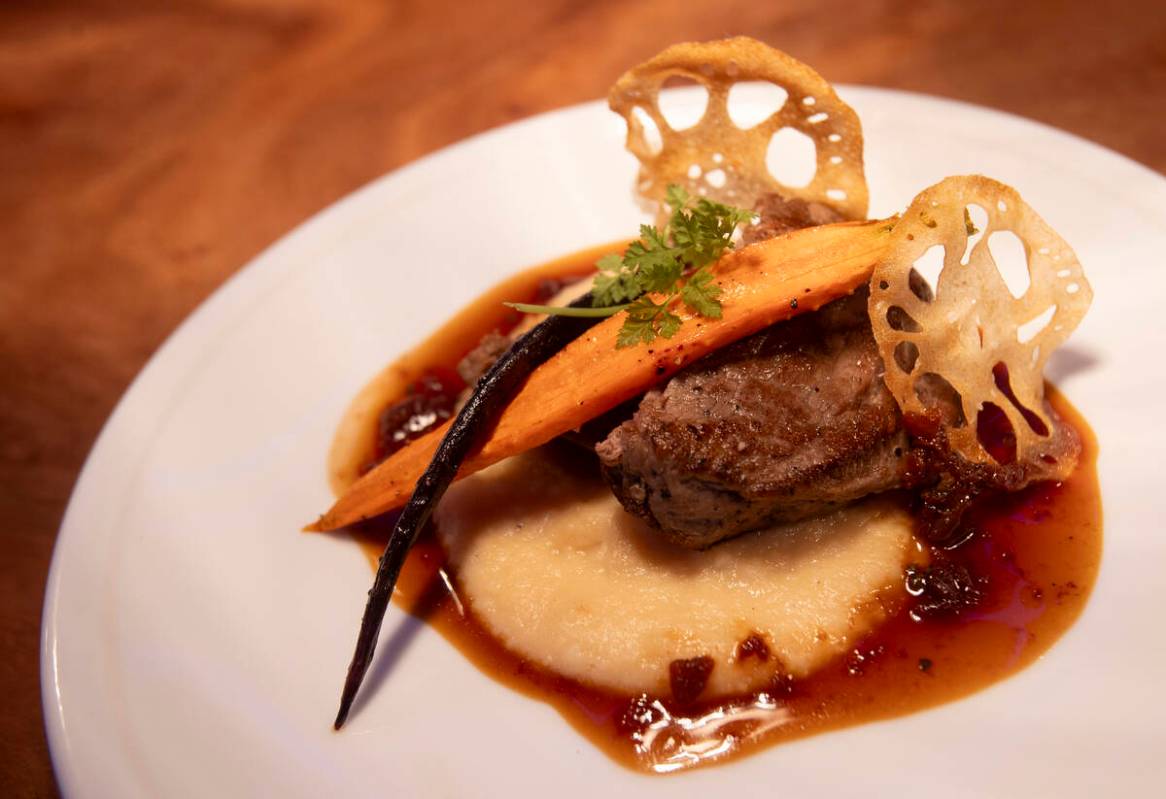 A plate of sous vide beef tenderloin is seen during a preview of luxury hospitality offerings a ...