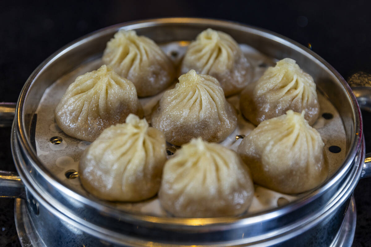 Traditional xiaolongbao (often called Shanghai soup dumplings) from ShangHai Taste, which has t ...