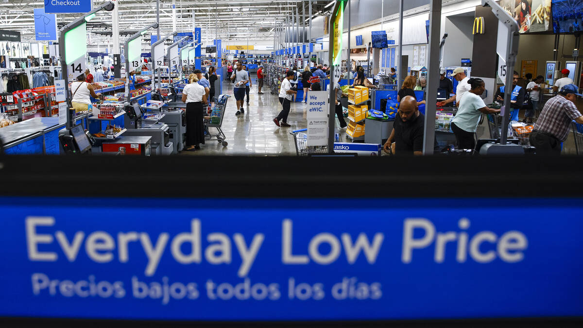 Customers use self check out at a Walmart Superstore in Secaucus, New Jersey, July 11, 2024. (A ...