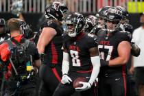 Atlanta Falcons tight end Kyle Pitts (8) reacts after a touchdown catch during the first half o ...