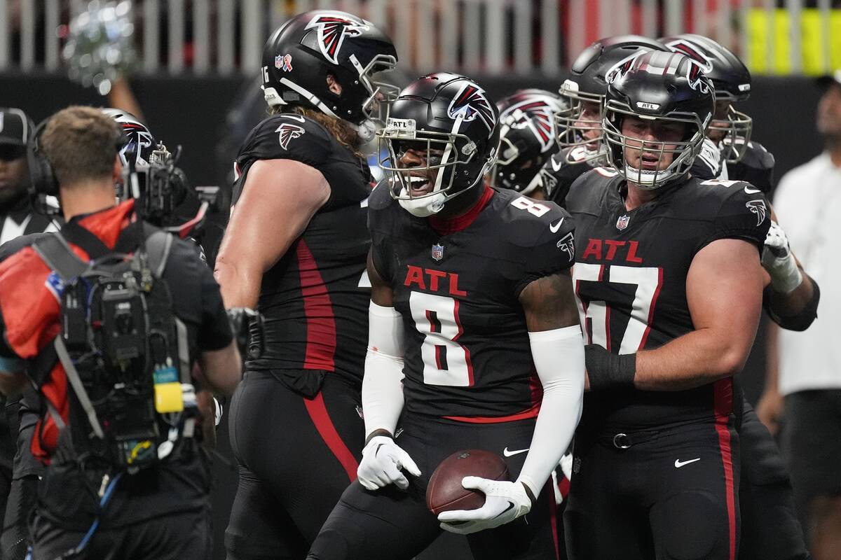 Atlanta Falcons tight end Kyle Pitts (8) reacts after a touchdown catch during the first half o ...