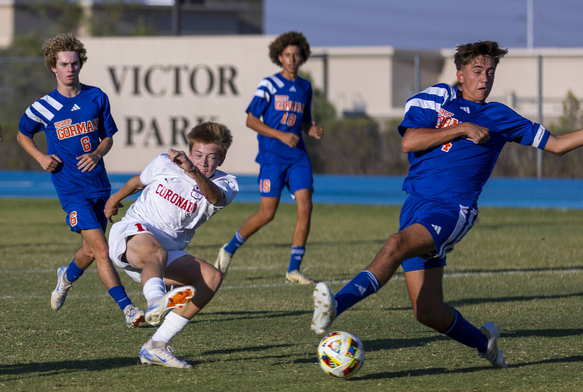 Coronado midfielder Liam Bringhurst (12) takes a shot on goal past Bishop Gorman defender Massi ...