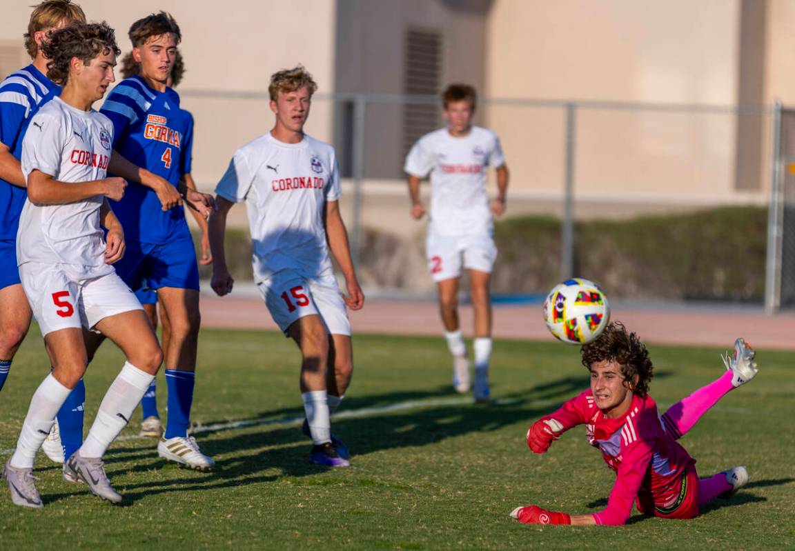 Bishop Gorman goalkeeper Chase Cosenza (99) deflects away a shot by Coronado during the first h ...