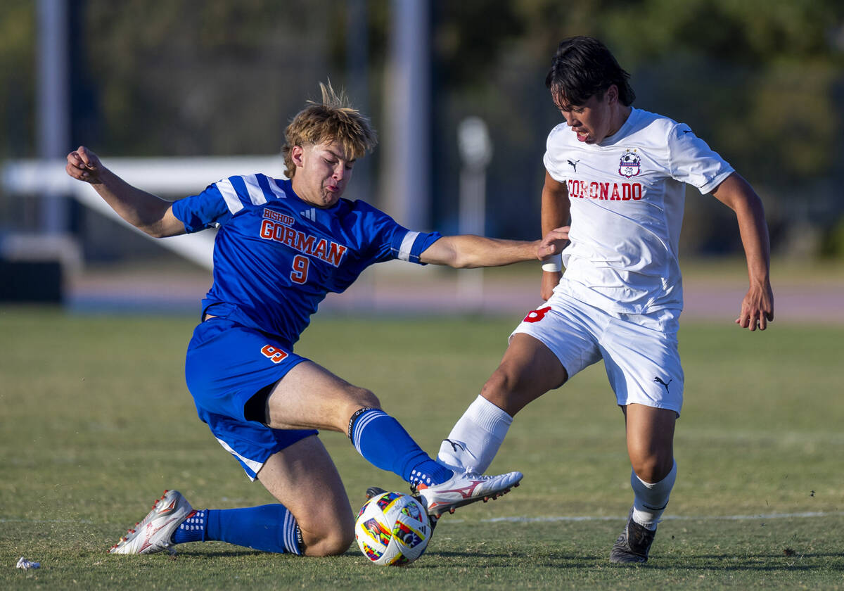 Bishop Gorman forward Chase Stewart (9) battles for the ball with Coronado midfielder Dalton Me ...