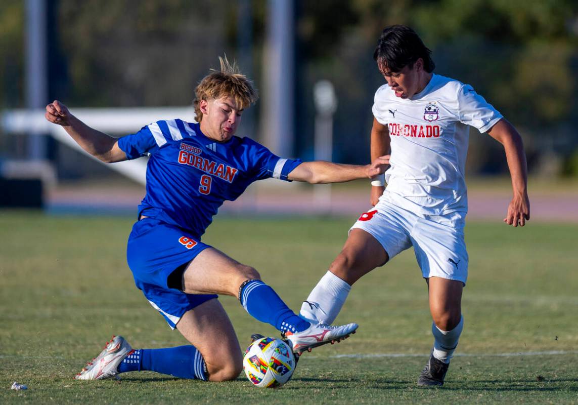 Bishop Gorman forward Chase Stewart (9) battles for the ball with Coronado midfielder Dalton Me ...