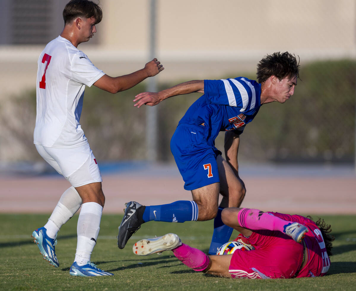 Bishop Gorman goalkeeper Chase Cosenza (99) dives on a shot by Coronado forward Austin Kiernan ...