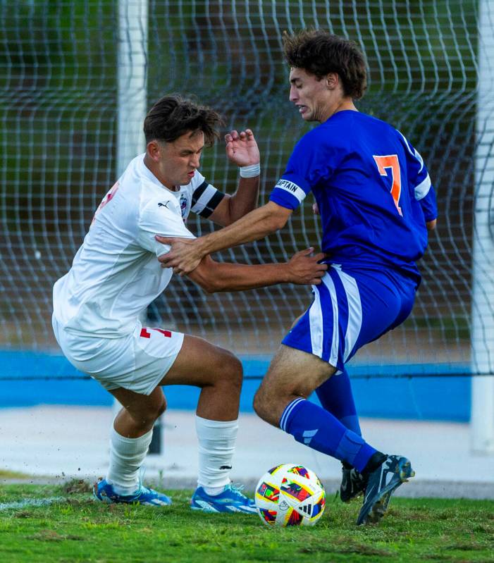 Coronado forward Austin Kiernan (7) battles for control with Bishop Gorman midfielder Maddix Bo ...