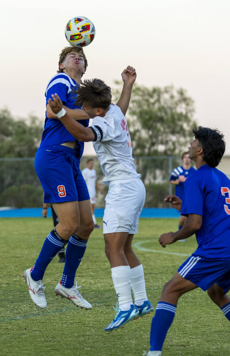 Bishop Gorman forward Chase Stewart (9) heads the ball past Coronado forward Austin Kiernan (7) ...