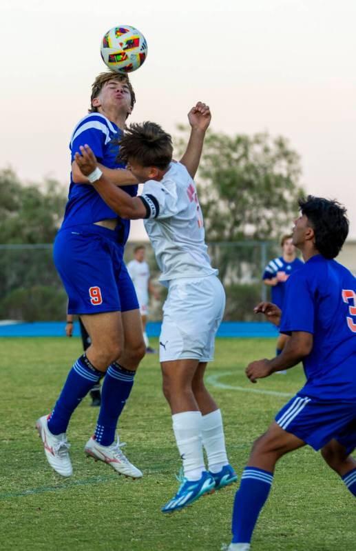 Bishop Gorman forward Chase Stewart (9) heads the ball past Coronado forward Austin Kiernan (7) ...