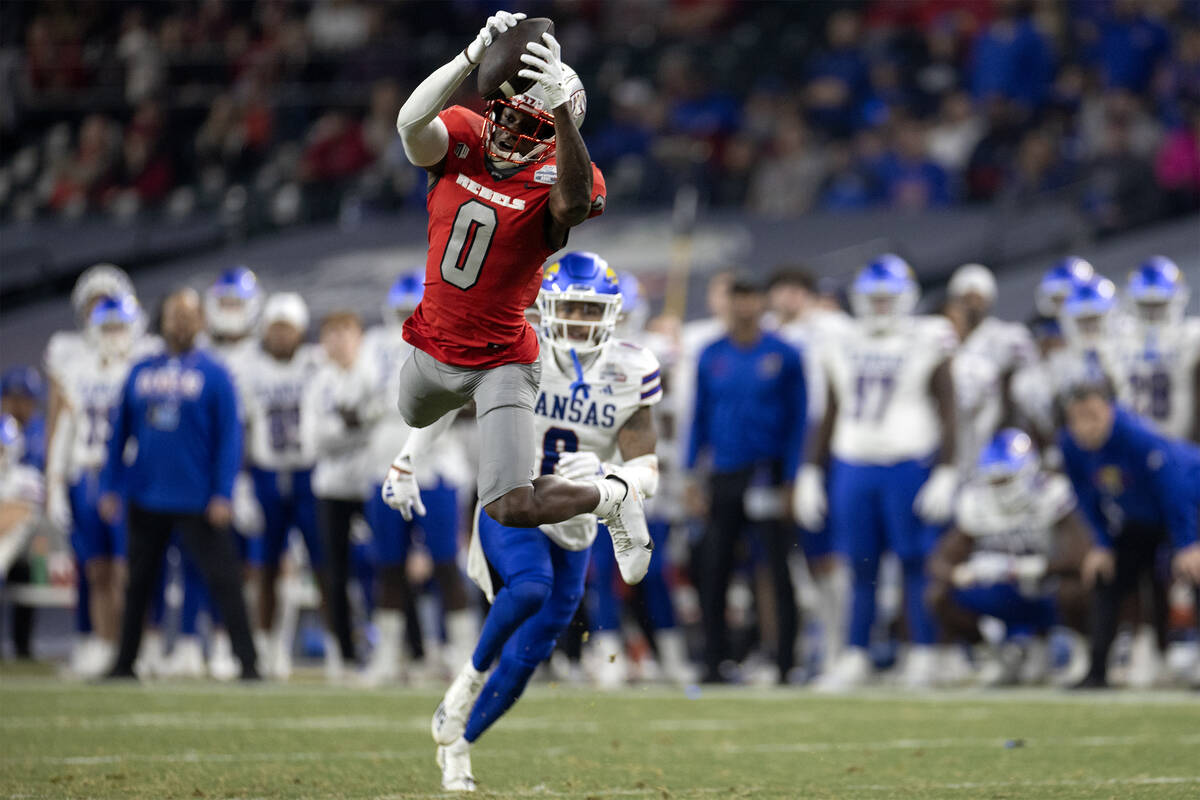 UNLV Rebels wide receiver Senika McKie (0) catches a pass while Kansas Jayhawks cornerback Kwin ...