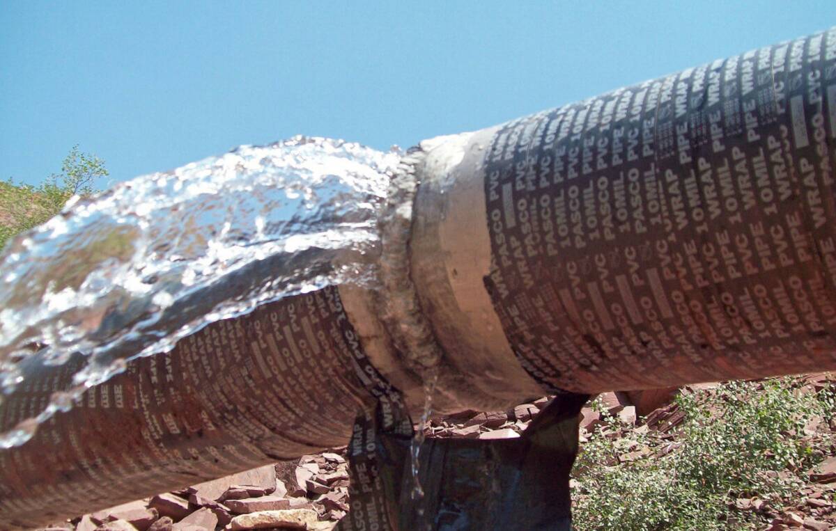 This photo shows water spraying from a break in an exposed section of the Grand Canyon trans-ca ...