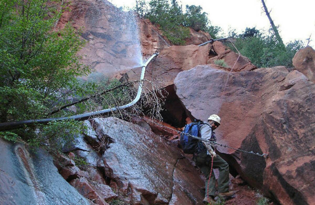 This photo shows water spraying from a break in an exposed section of the Grand Canyon trans-ca ...