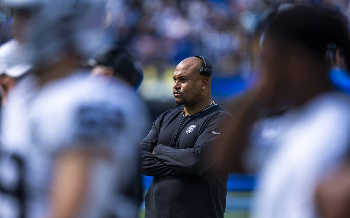 Raiders head coach Antonio Pierce watches the game along the sidelines as they face the Los Ang ...