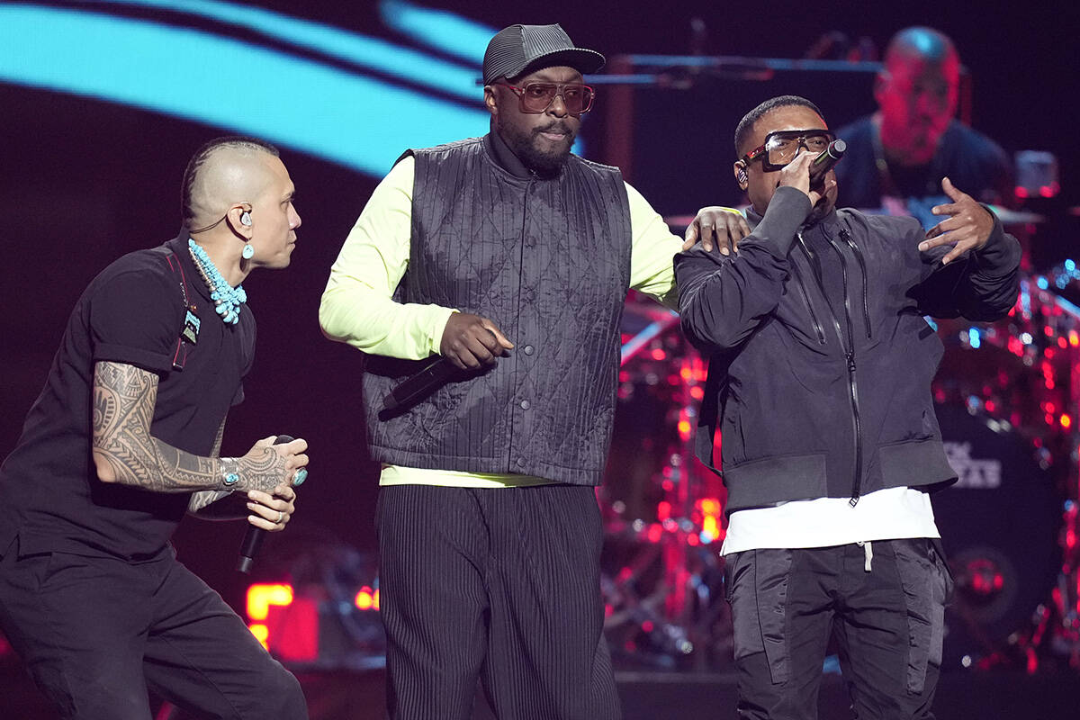 From left, Taboo, will.i.am and apl.de.ap of The Black Eyed Peas perform on the first night of ...