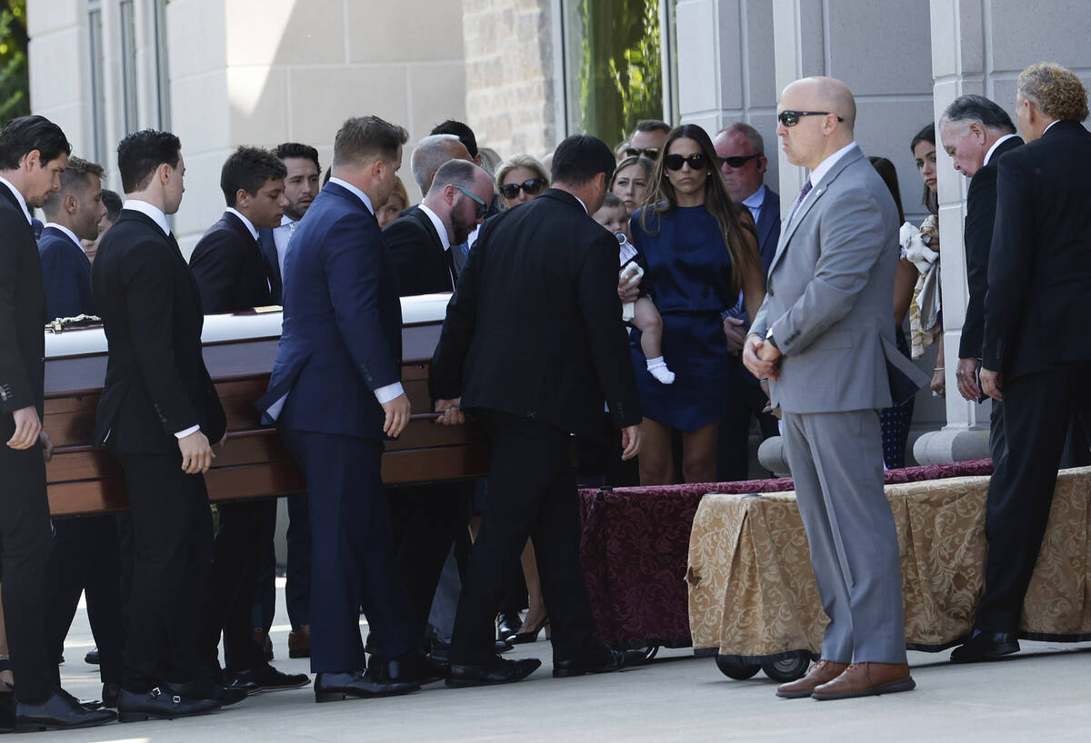 Pallbearers carry the casket of Columbus Blue Jackets hockey player John Gaudreau before funera ...