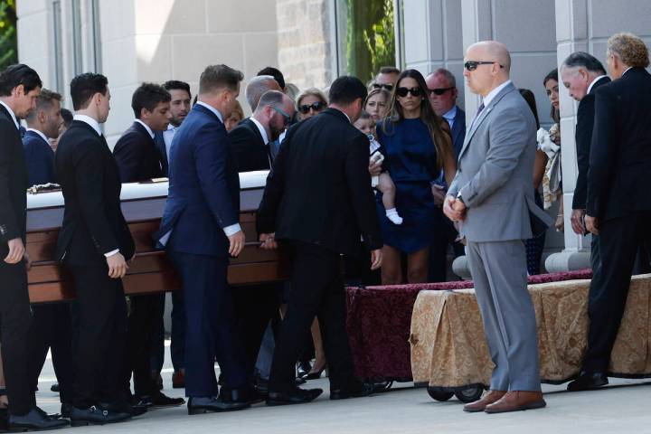 Pallbearers carry the casket of Columbus Blue Jackets hockey player John Gaudreau before funera ...