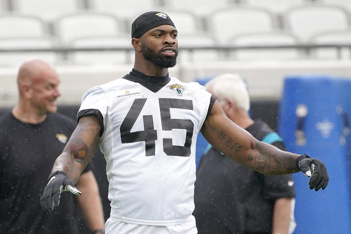 Jacksonville Jaguars K'Lavon Chaisson (45) warms up before an NFL football practice, Tuesday, M ...