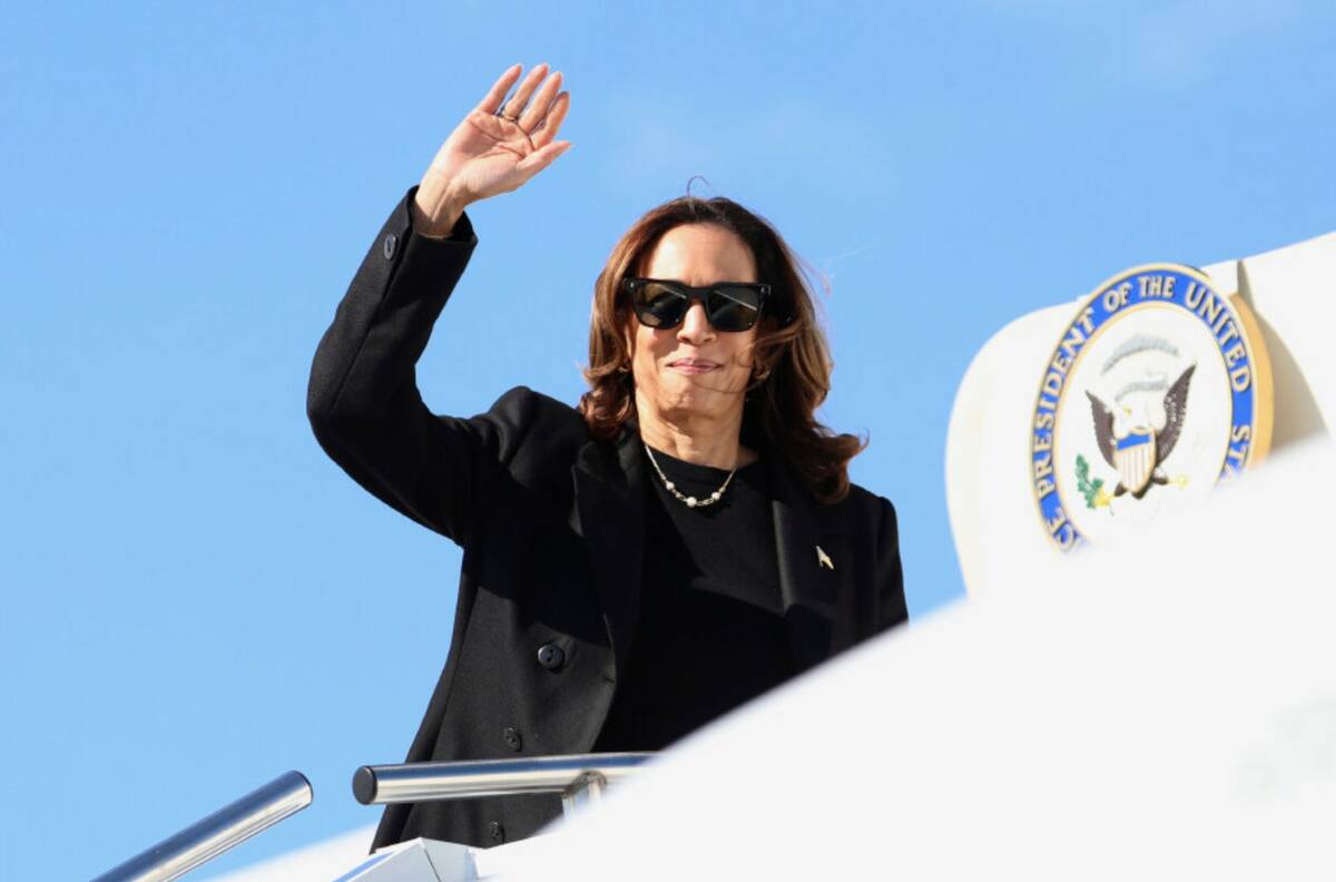 Vice President Kamala Harris waves she boards Air Force Two en route to Philadelphia, Monday, S ...