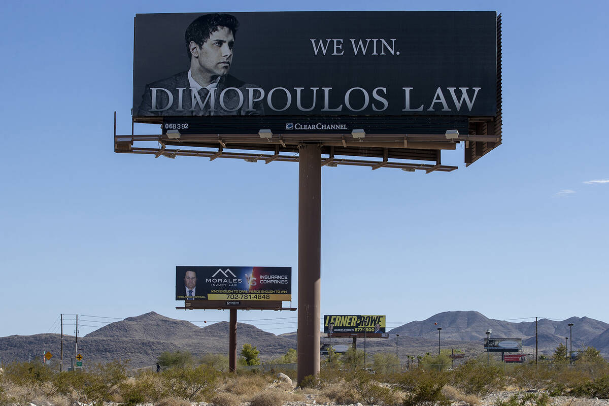 Multiple billboards advertise different law firms, Thursday, Aug. 22, 2024, in Henderson. (Dani ...