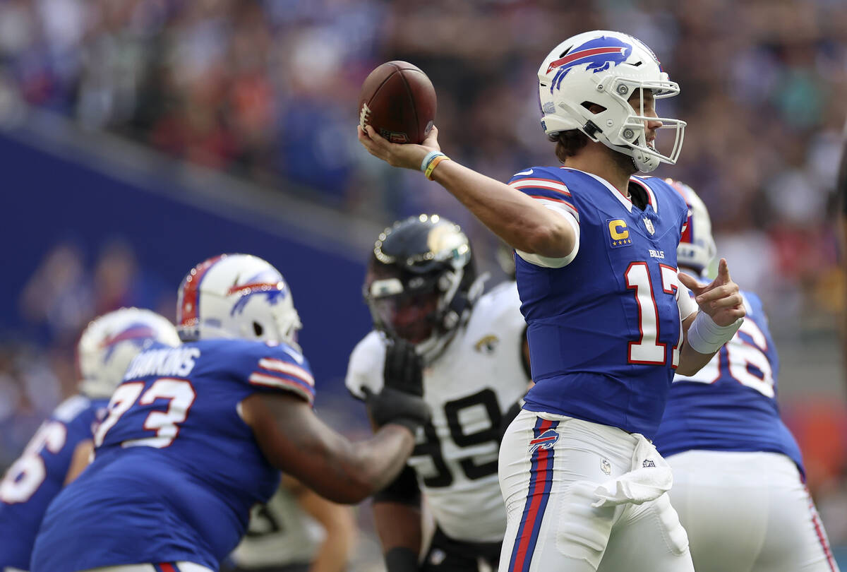 FILE - Buffalo Bills quarterback Josh Allen (17) passes the ball during an NFL football game be ...