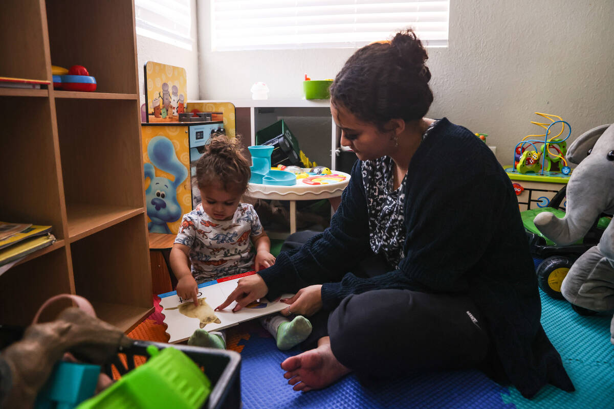 Katherine Sheffey plays with her son Kyo Sheffey, 2, at one of the properties owned by the nonp ...