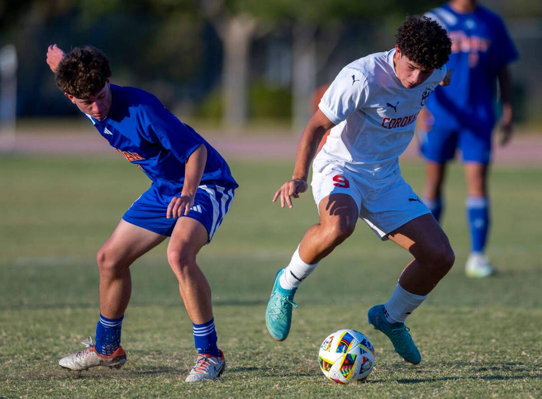 Bishop Gorman midfielder Rockwell Rabago (8) looks on as Coronado striker Dylan Flores (9) stea ...