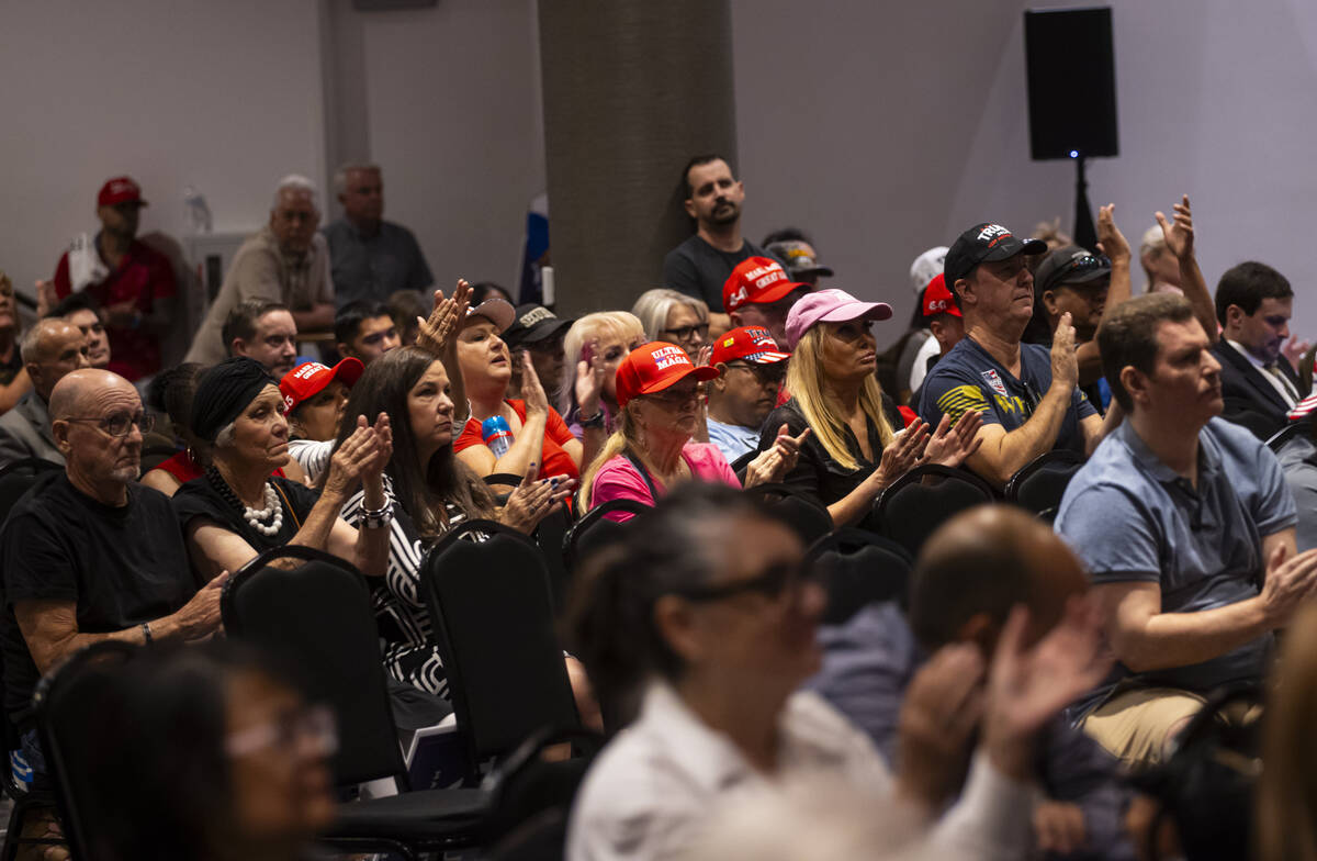 Supporters cheer at the end of a televised debate between Republican presidential nominee forme ...