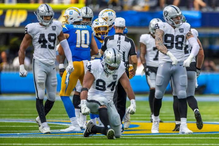 Raiders defensive tackle Christian Wilkins (94), defensive end Maxx Crosby (98) and defensive e ...