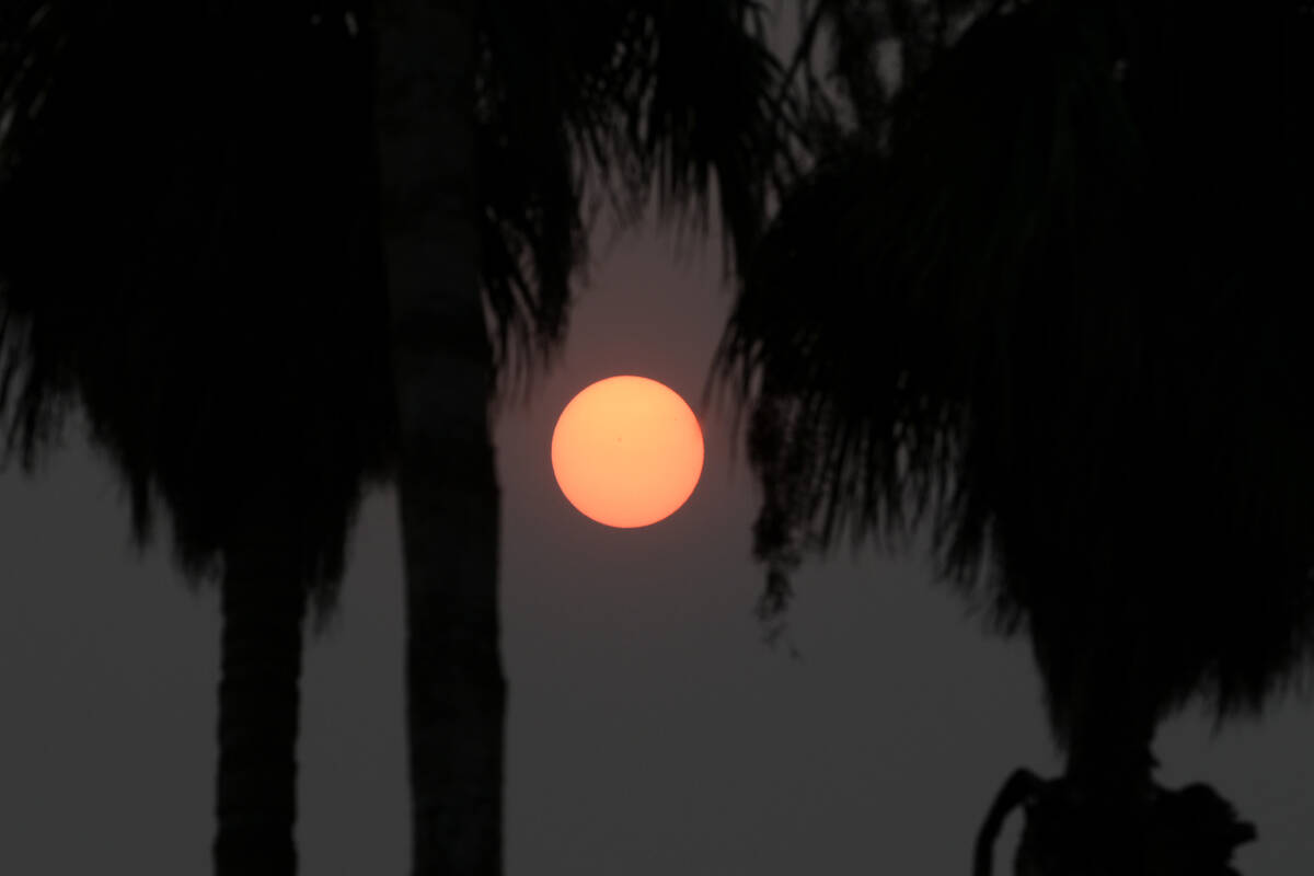 The morning sun in Las Vegas is muted by smoke from southern California wildfires Wednesday, Se ...