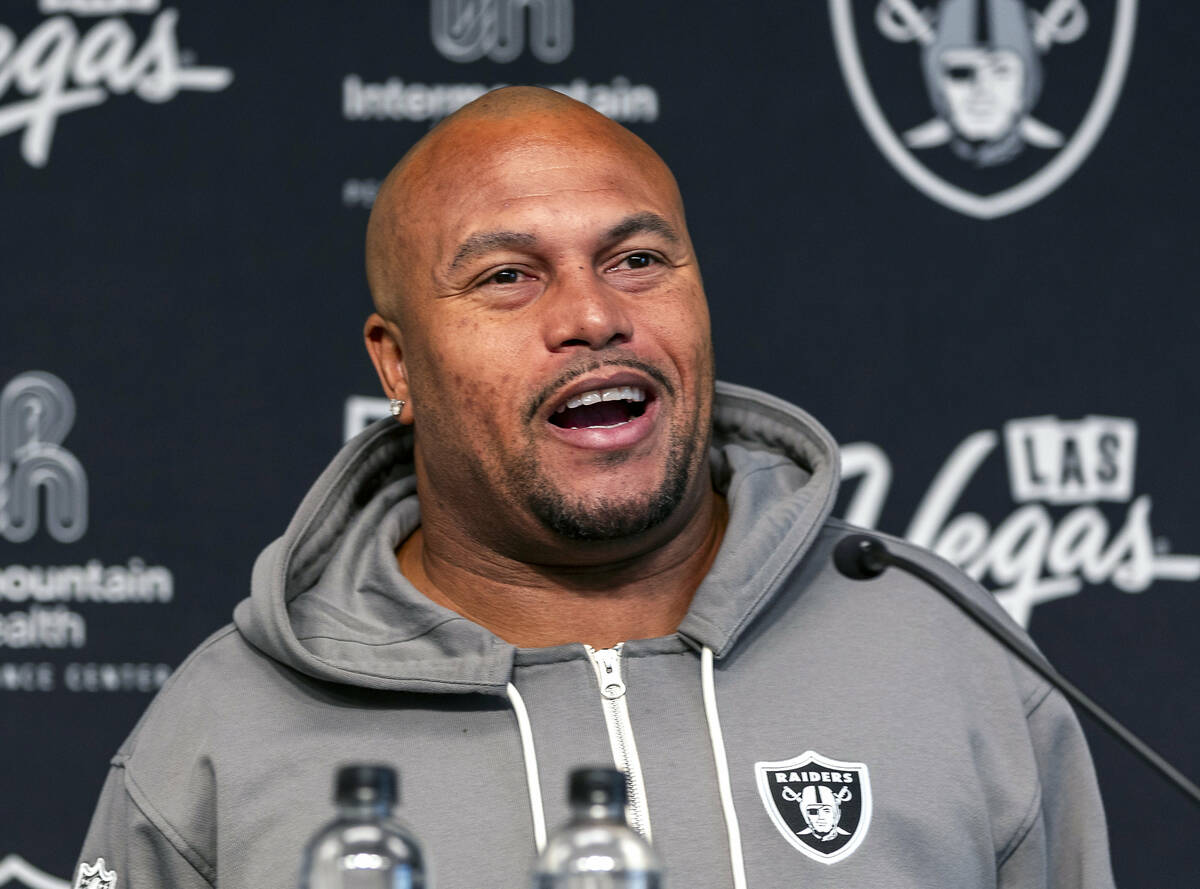 Raiders head coach Antonio Pierce answers a question during a media interview before practice a ...