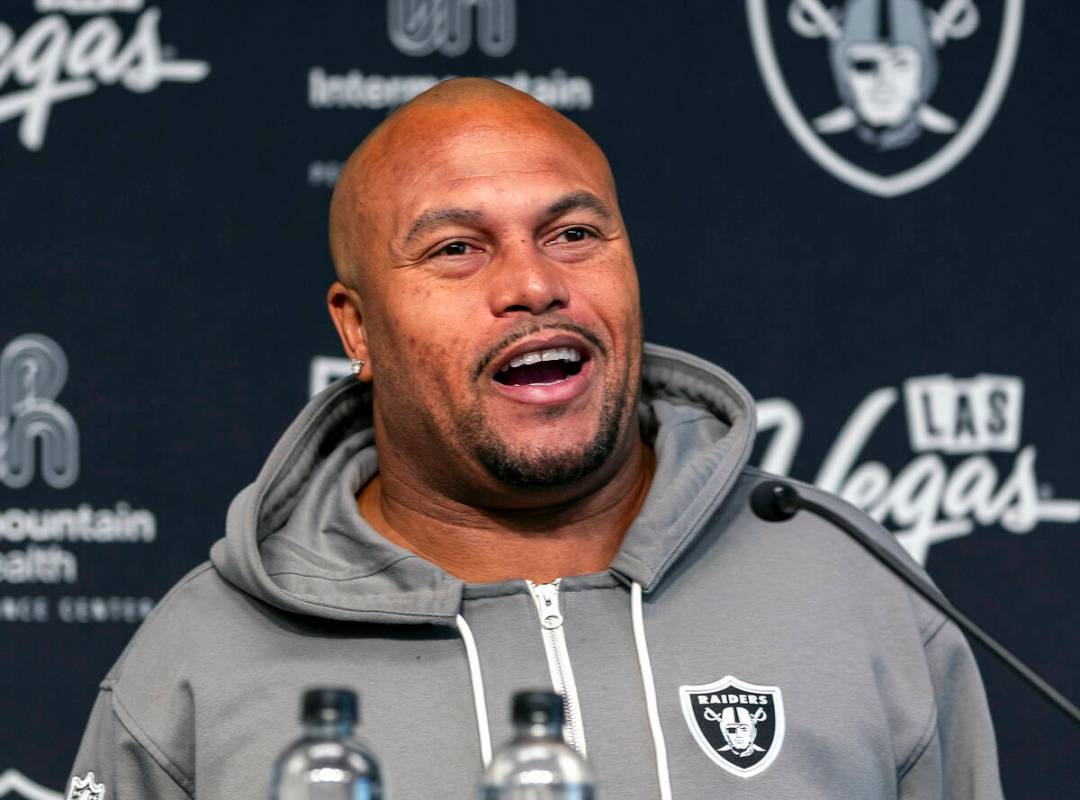 Raiders head coach Antonio Pierce answers a question during a media interview before practice a ...