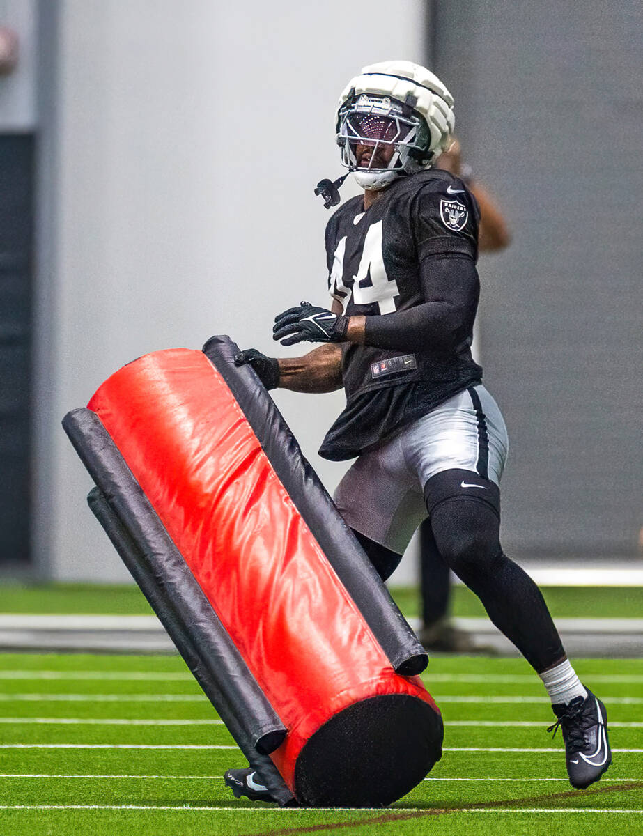 Raiders linebacker K'Lavon Chaisson (44) stands up a tackling dummy during practice at the Inte ...