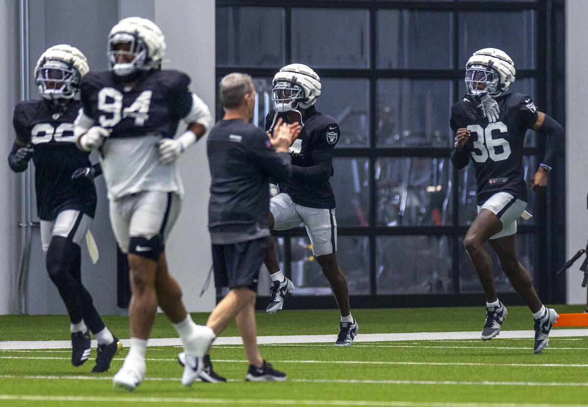 Raiders cornerback Kyu Blu Kelly (36) runs sprints in warm ups during practice at the Intermoun ...