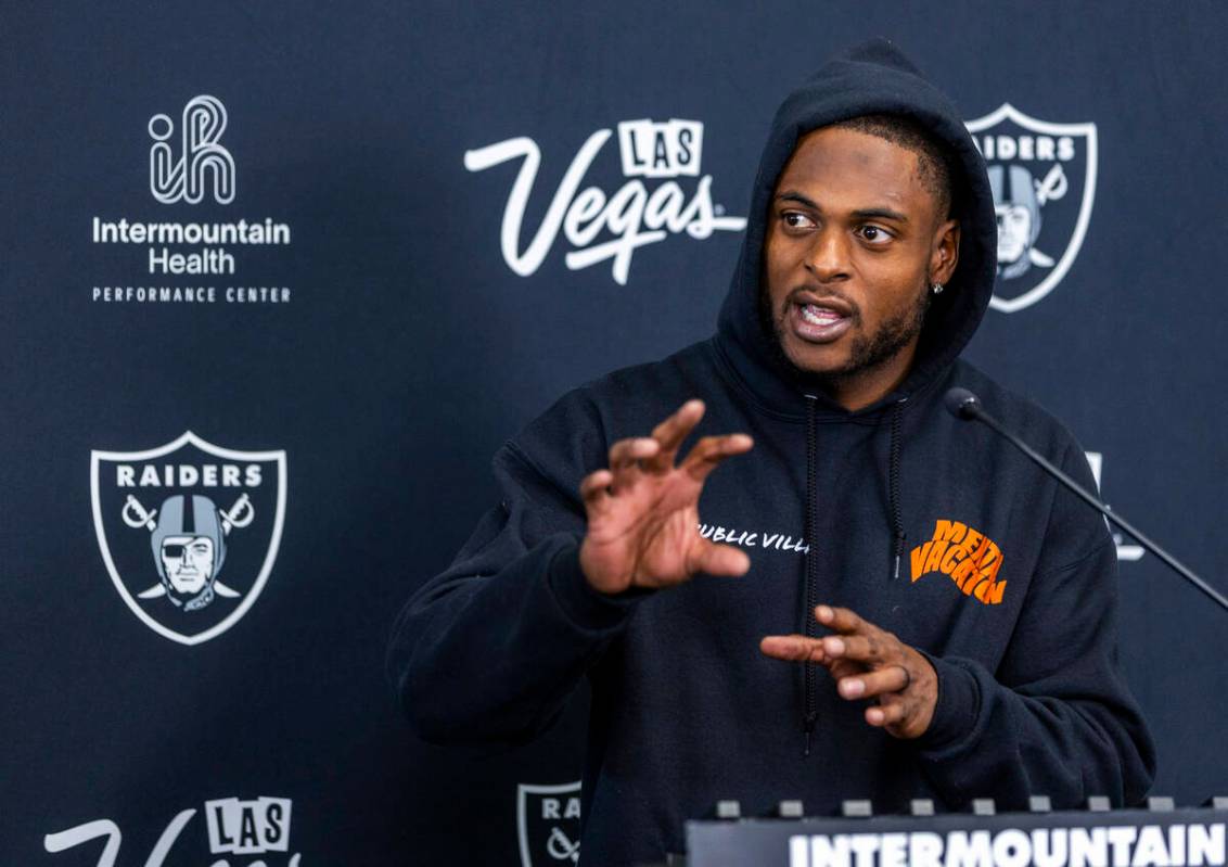 Raiders wide receiver Davante Adams (17) answers to a question during a media interview at the ...