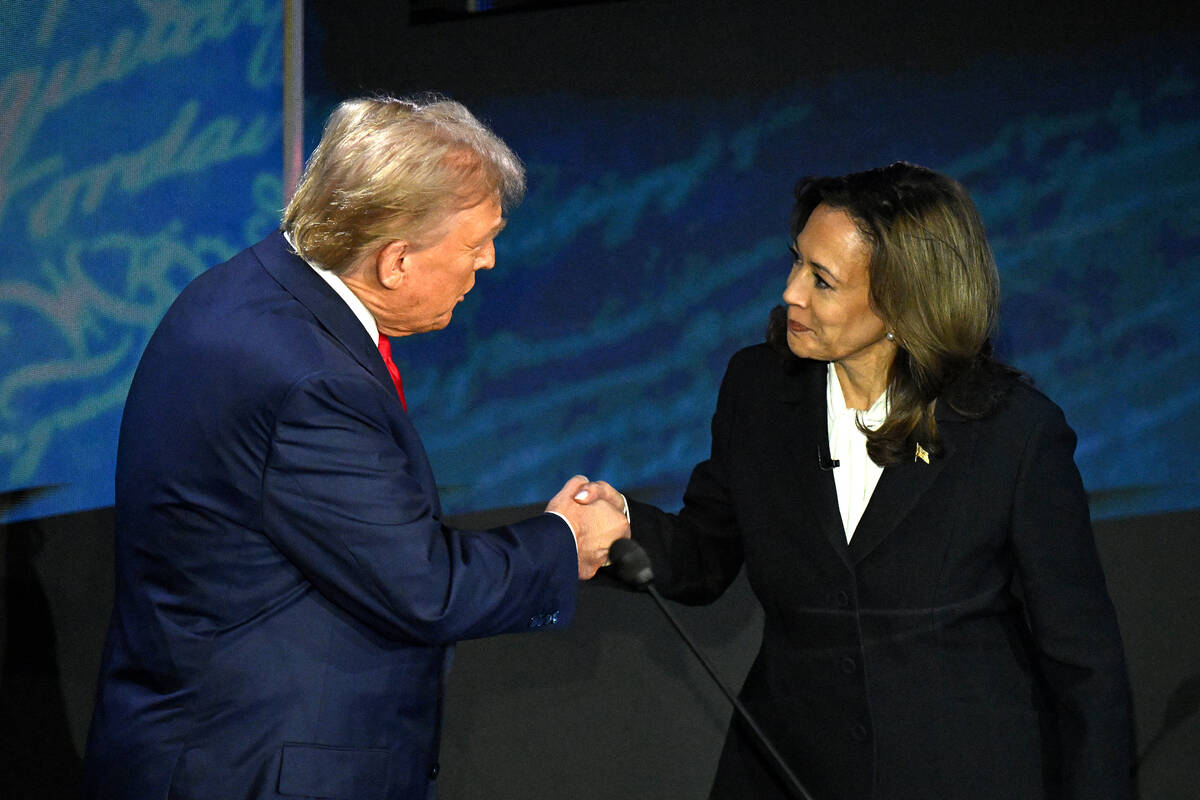 US Vice President and Democratic presidential candidate Kamala Harris (R) shakes hands with for ...