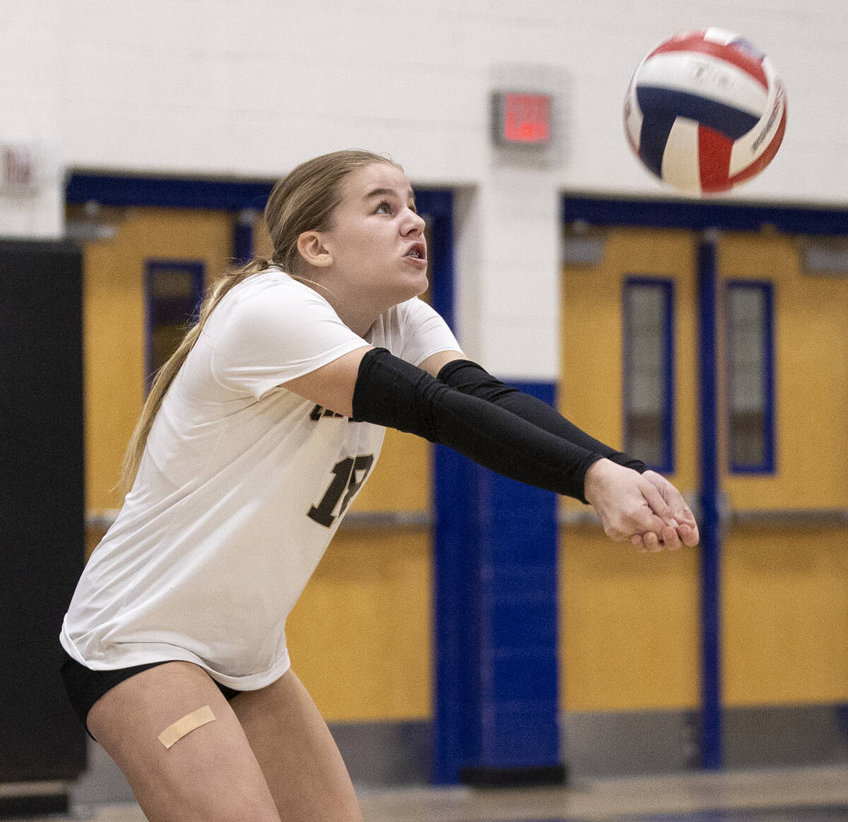 Faith Lutheran freshman Ellee Ford (18) competes during the high school volleyball game against ...