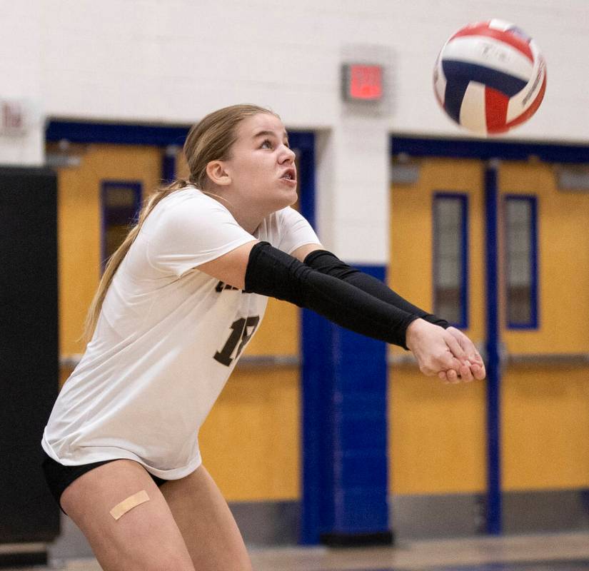 Faith Lutheran freshman Ellee Ford (18) competes during the high school volleyball game against ...