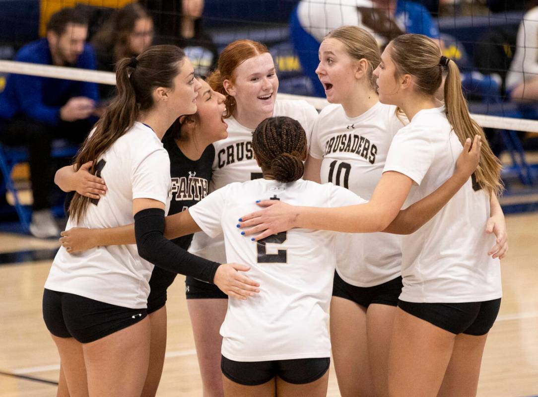 Faith Lutheran celebrates a point during the high school volleyball game against Sierra Vista a ...