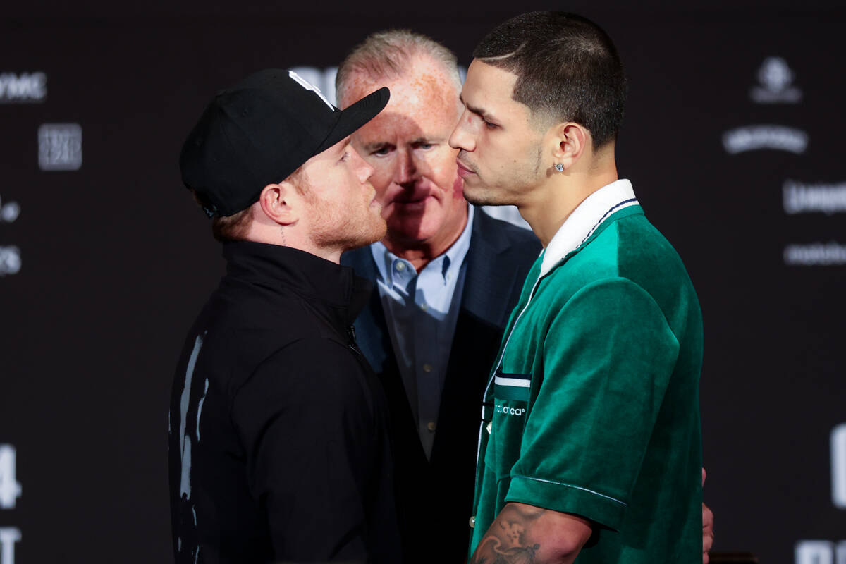 Canelo Alvarez, left, and Edgar Berlanga face off during a press conference ahead of their supe ...