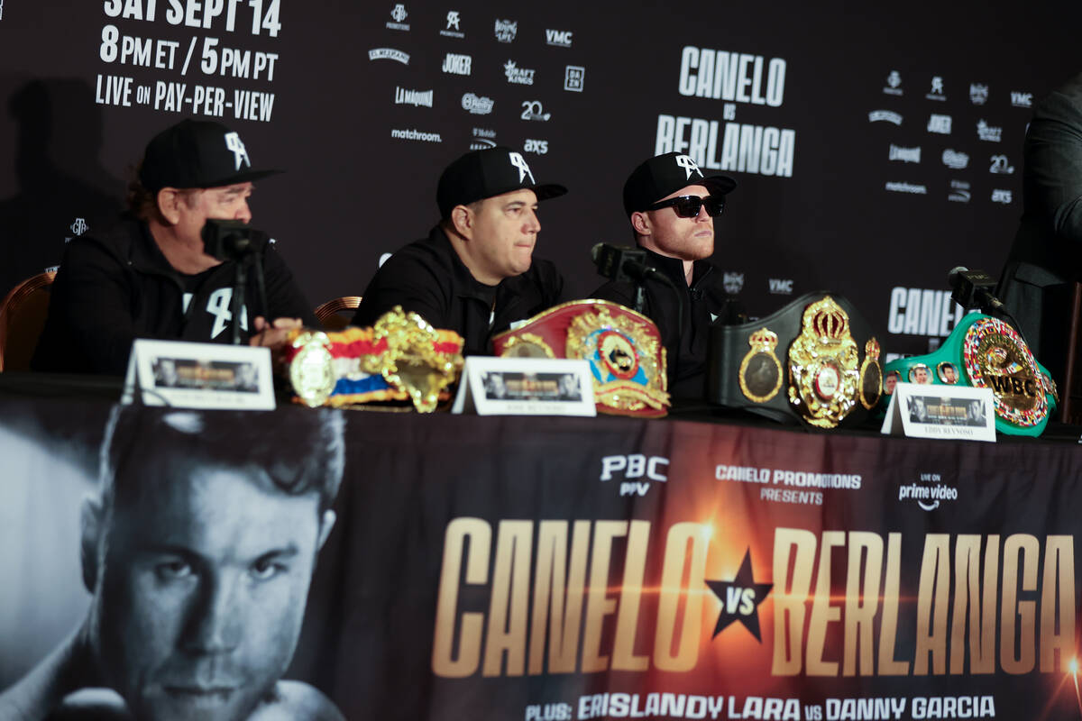 Canelo Alvarez, right, and his team sit on stage during press conference ahead of his super mid ...