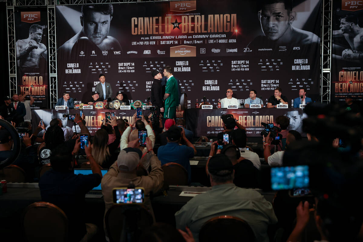 Canelo Alvarez, left, and Edgar Berlanga face off during a press conference ahead of their supe ...