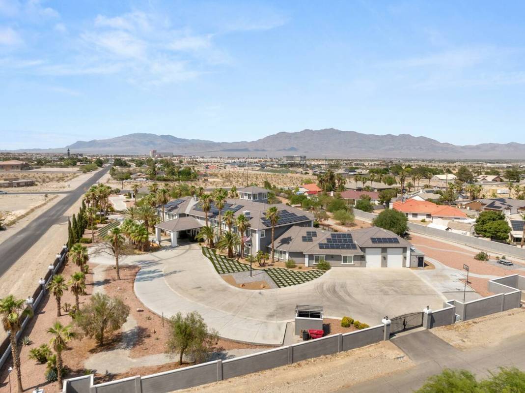 This Centennial Hills home is currently on the market for $11.99 million. It sits on nearly 4 a ...