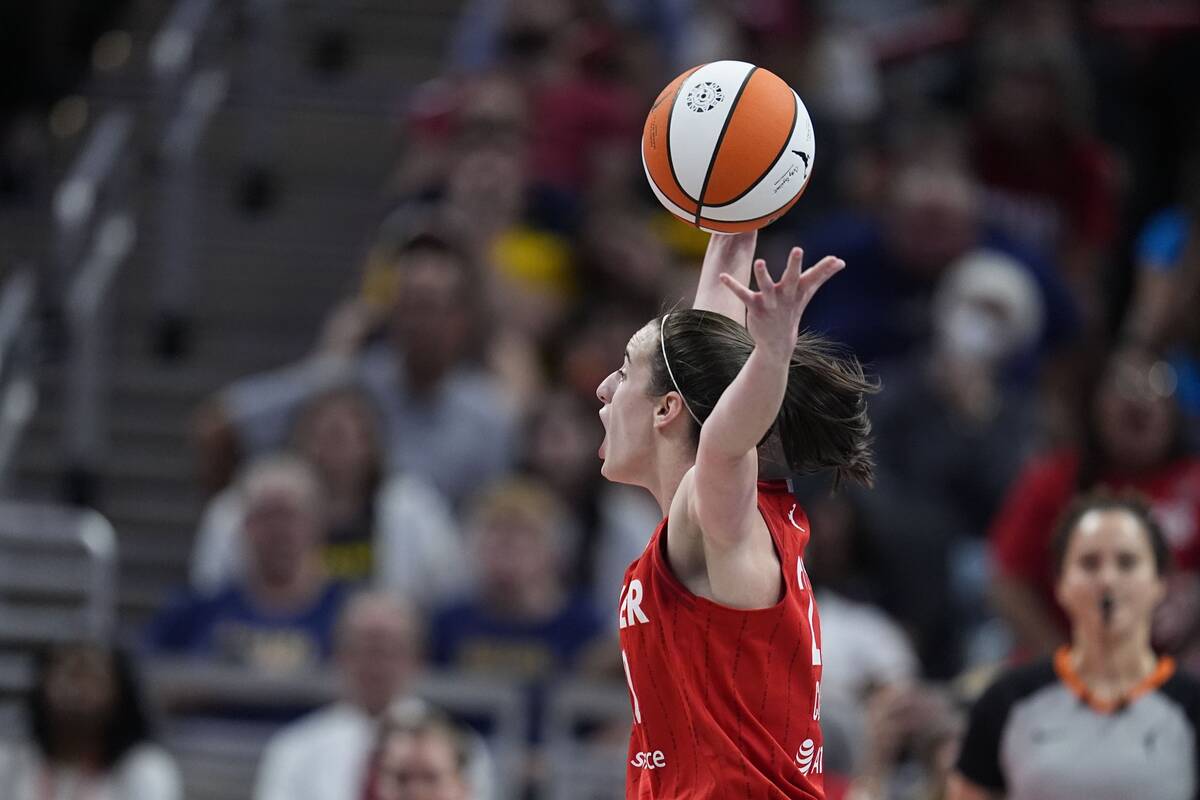 Indiana Fever's Caitlin Clark reacts after being called for a foul during the second half of a ...