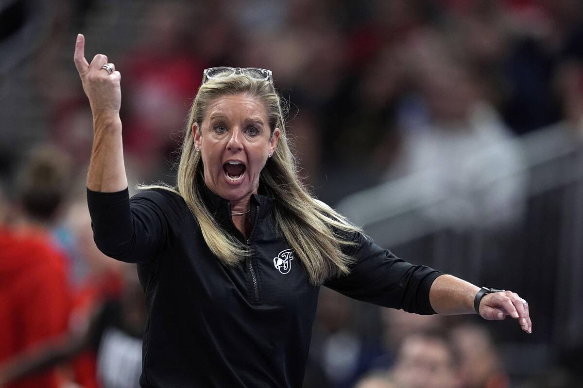 Indiana Fever head coach Christie Sides questions a call during the second half of a WNBA baske ...